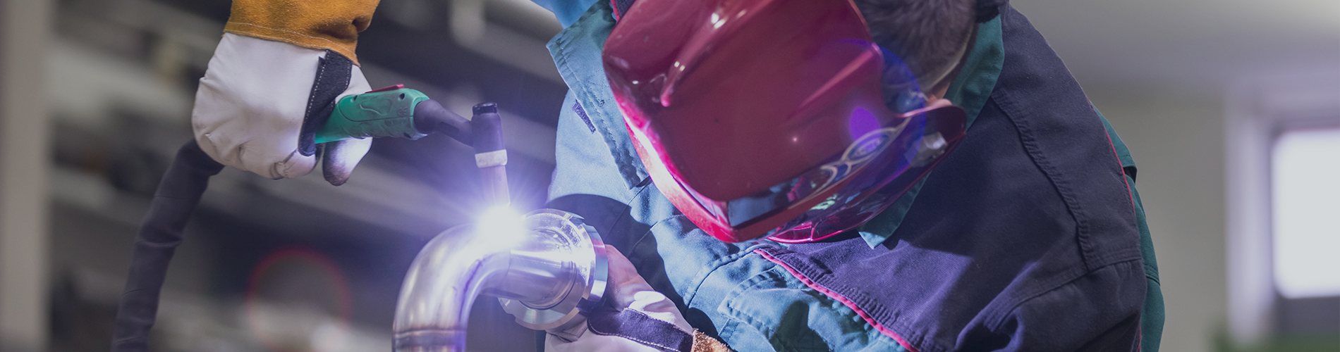 Skilled welder crafting precise welds with protective gear